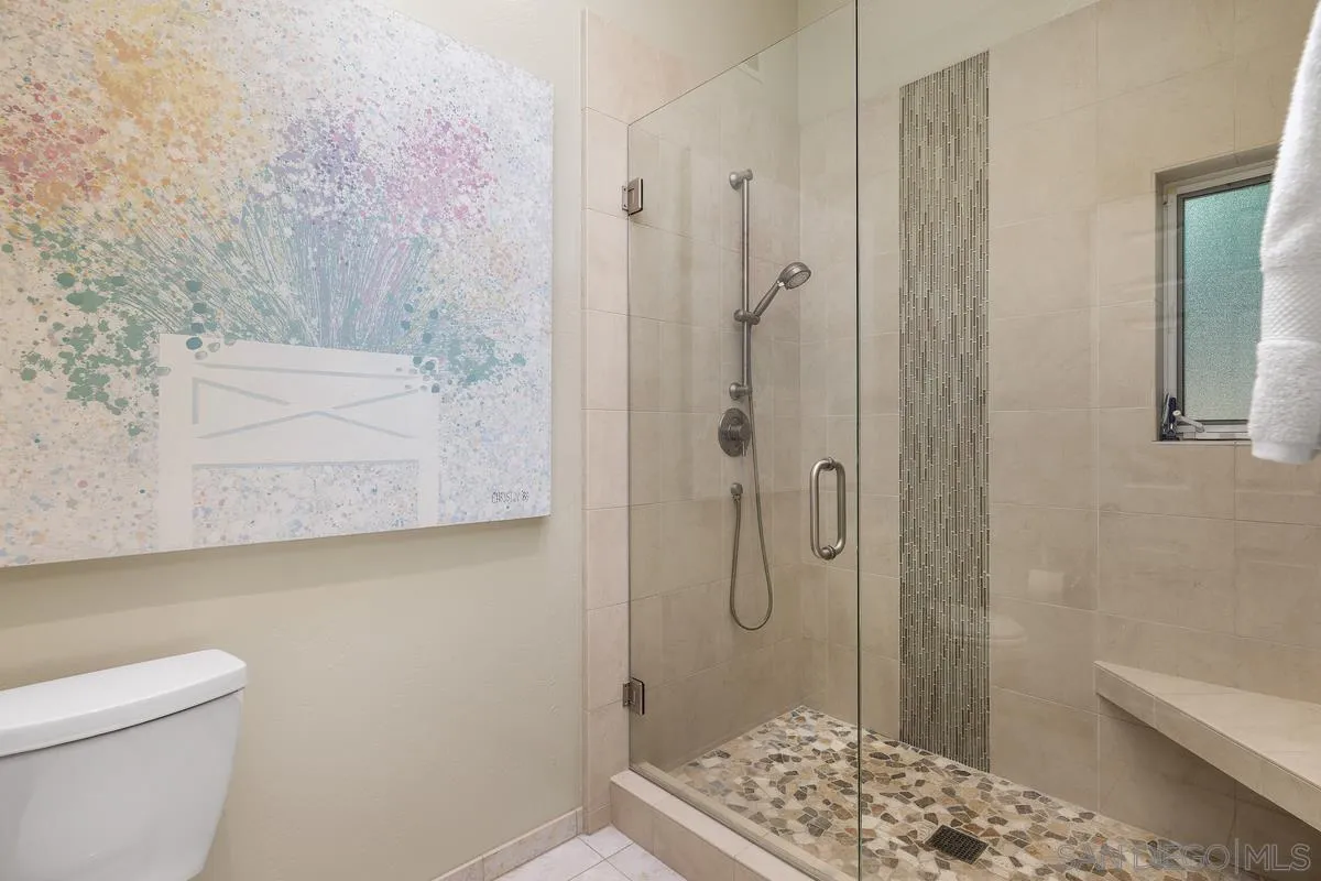 5625 Caminito Isla La Jolla, CA 92037 - Photo 14 of 29 a bathroom with a shower and a toilet