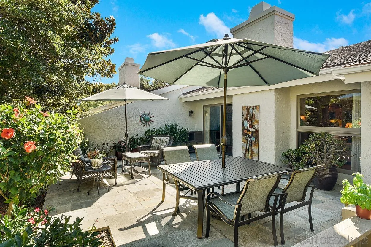 5625 Caminito Isla La Jolla, CA 92037 - Photo 19 of 29 a patio with a patio table and chairs