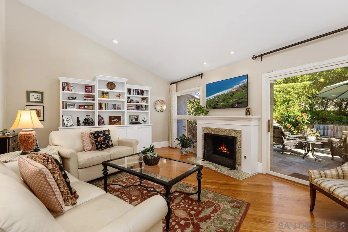 5625 Caminito Isla La Jolla, CA 92037 - Photo 2 of 29 a living room with furniture fireplace and a large window