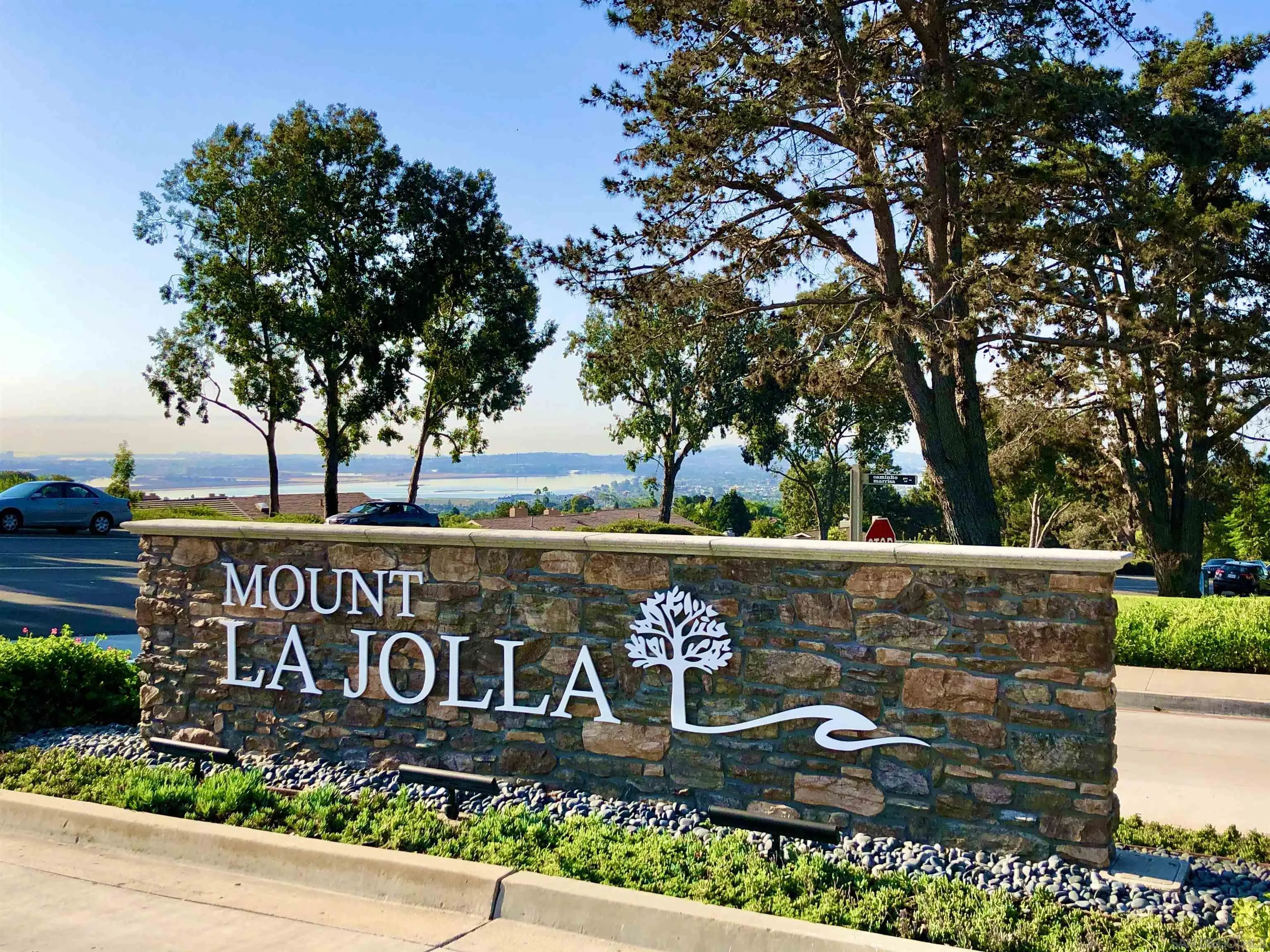 5625 Caminito Isla La Jolla, CA 92037 - Photo 25 of 29 a sign that is sitting on a brick wall