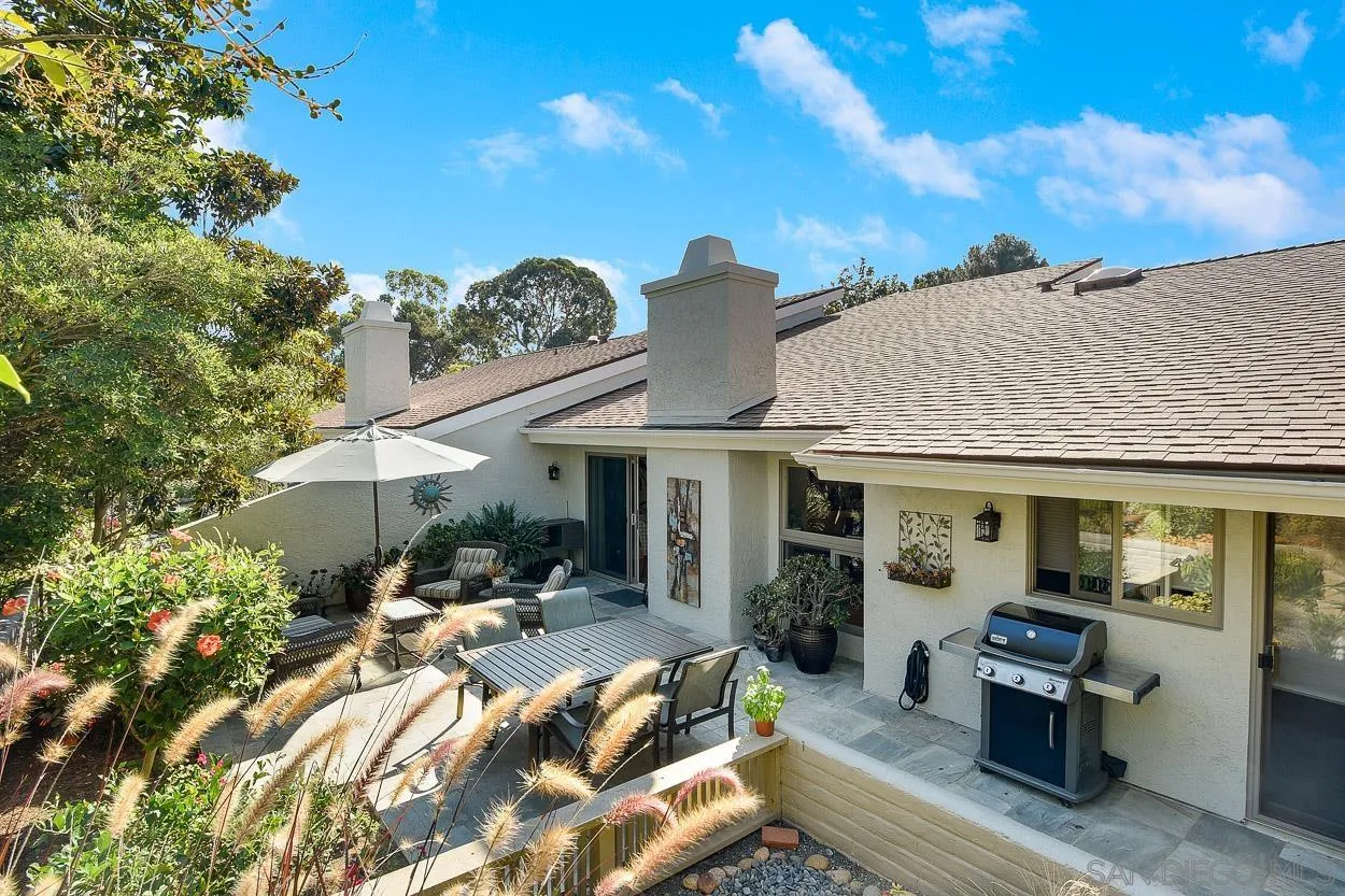 5625 Caminito Isla La Jolla, CA 92037 - Photo 4 of 29 a view of a patio with table and chairs under an umbrella