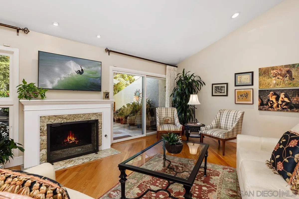 5625 Caminito Isla La Jolla, CA 92037 - Photo 8 of 29 a living room with furniture a fireplace and a flat screen tv
