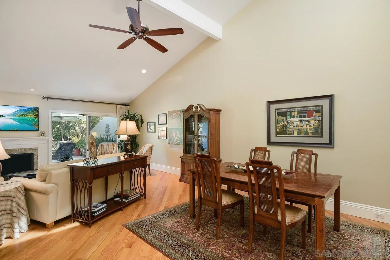 5625 Caminito Isla La Jolla, CA 92037 - Photo 9 of 29 a dining room with furniture a rug and wooden floor