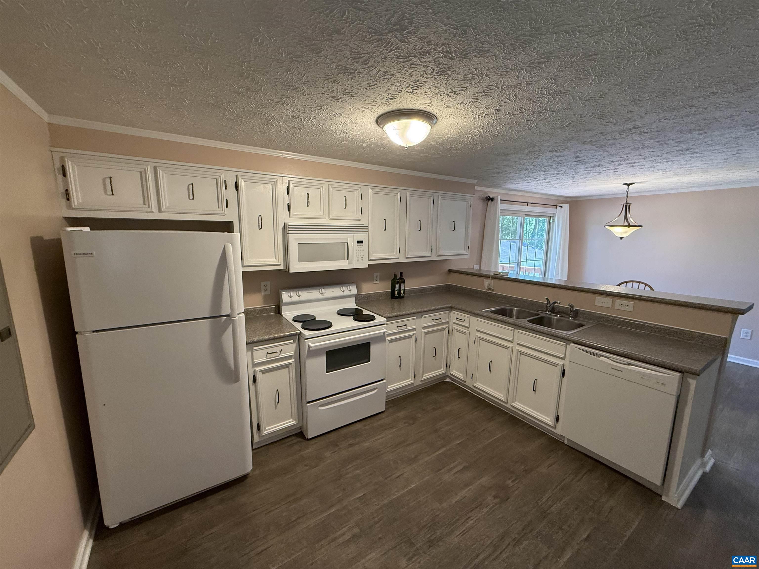 2002 Oliver Creek Road Troy, VA 22974 - Photo 5 of 38 a kitchen with white cabinets and white appliances