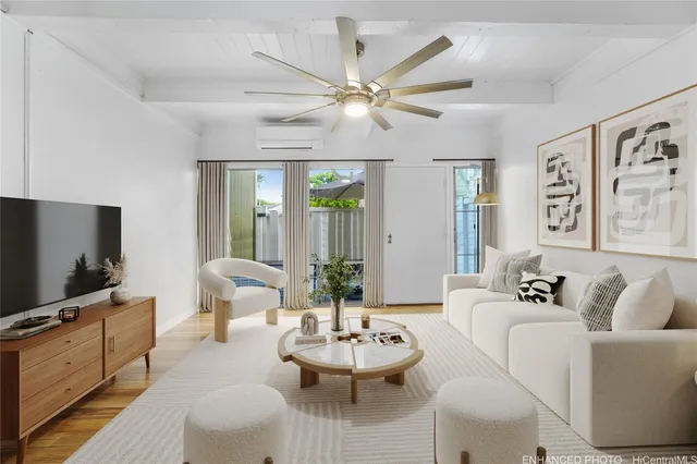 a living room with furniture and a flat screen tv