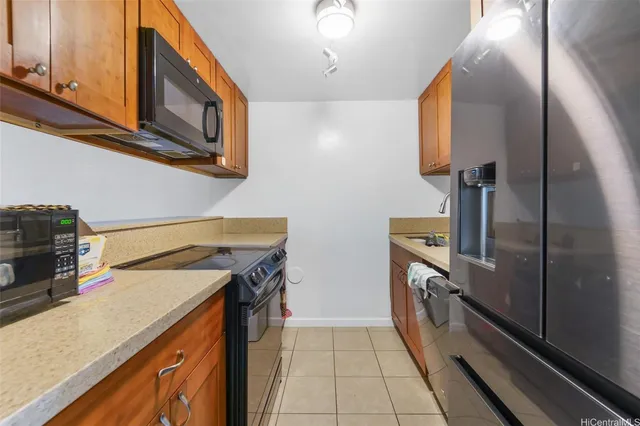 a kitchen with a stove microwave and sink