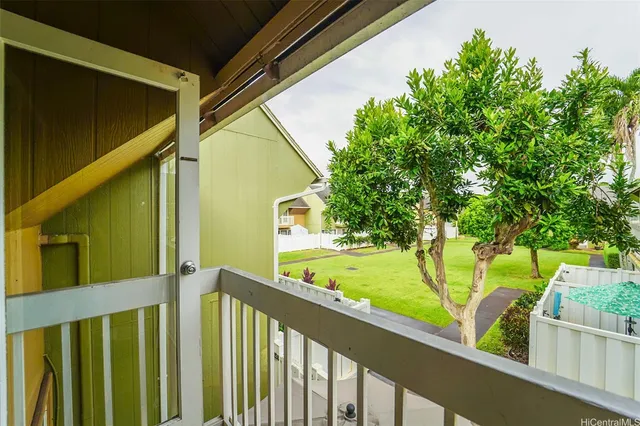 a view of a small yard and swimming pool