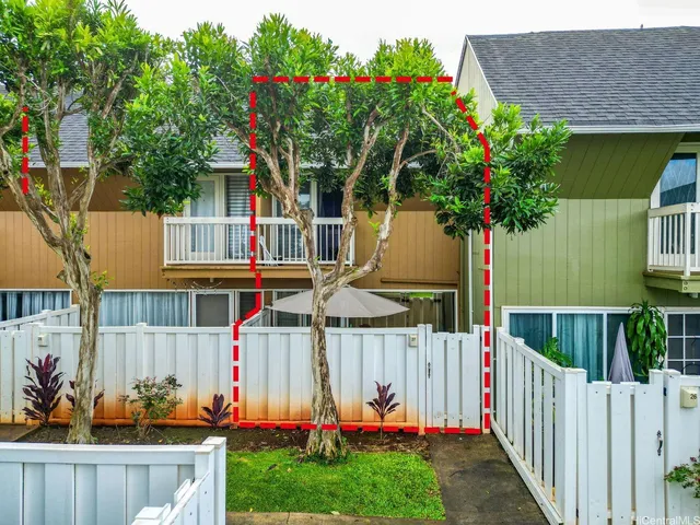 a view of small house in the background