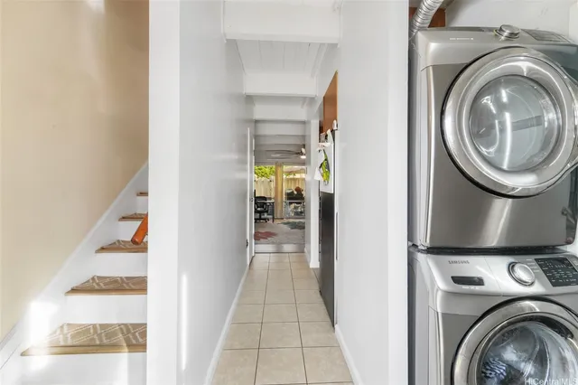 a view of a hallway with washer and dryer