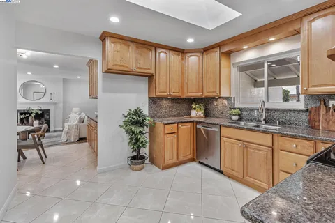 a kitchen with a refrigerator and cabinets