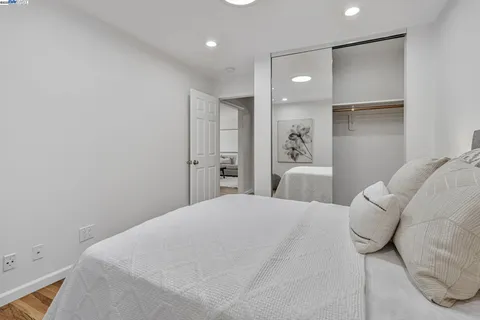 a large white bed in a white room