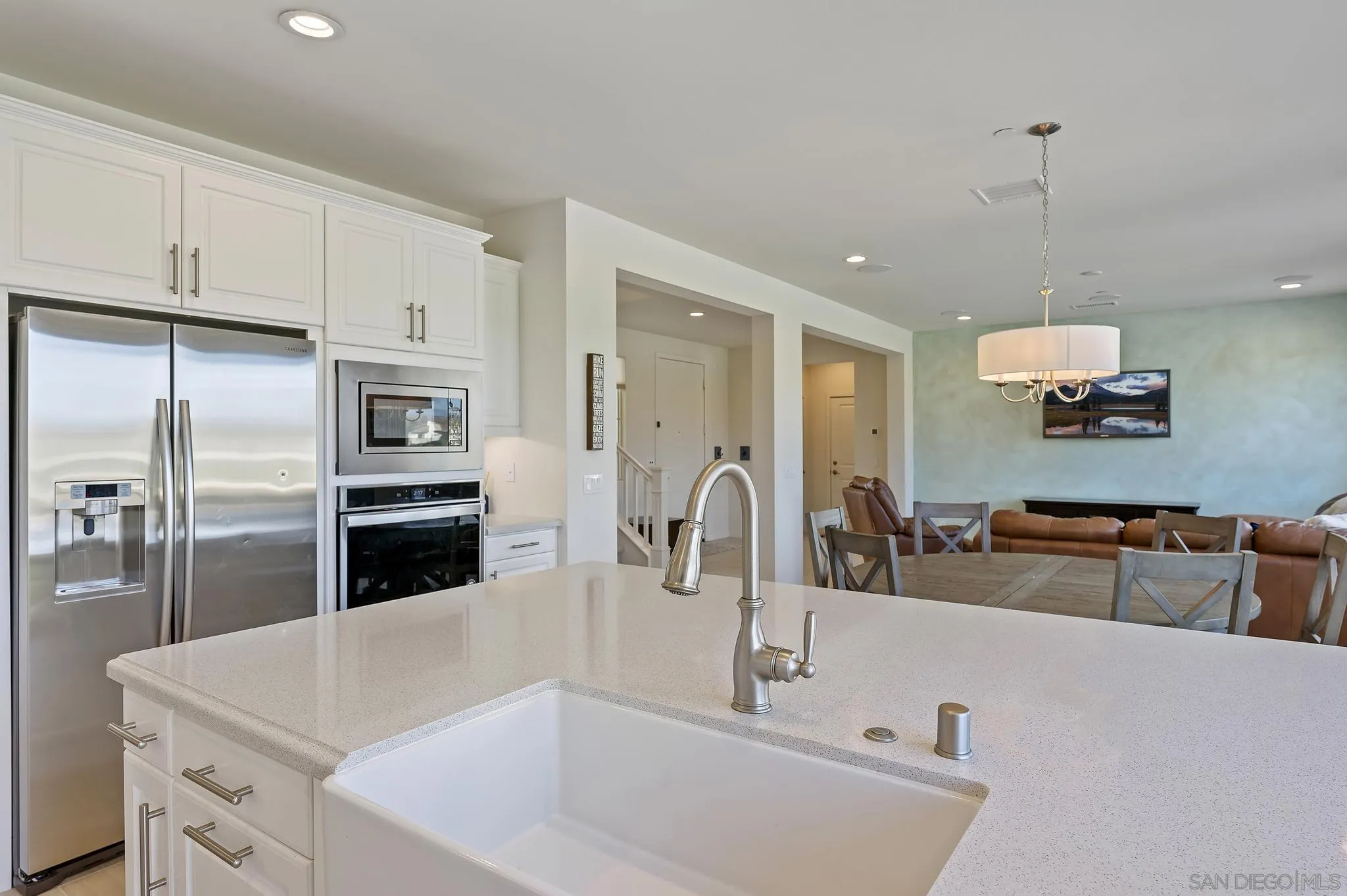 31657 Calle De Las Estrellas Bonsall, CA 92003 - Photo 14 of 30 a kitchen with stainless steel appliances granite countertop a sink and a refrigerator