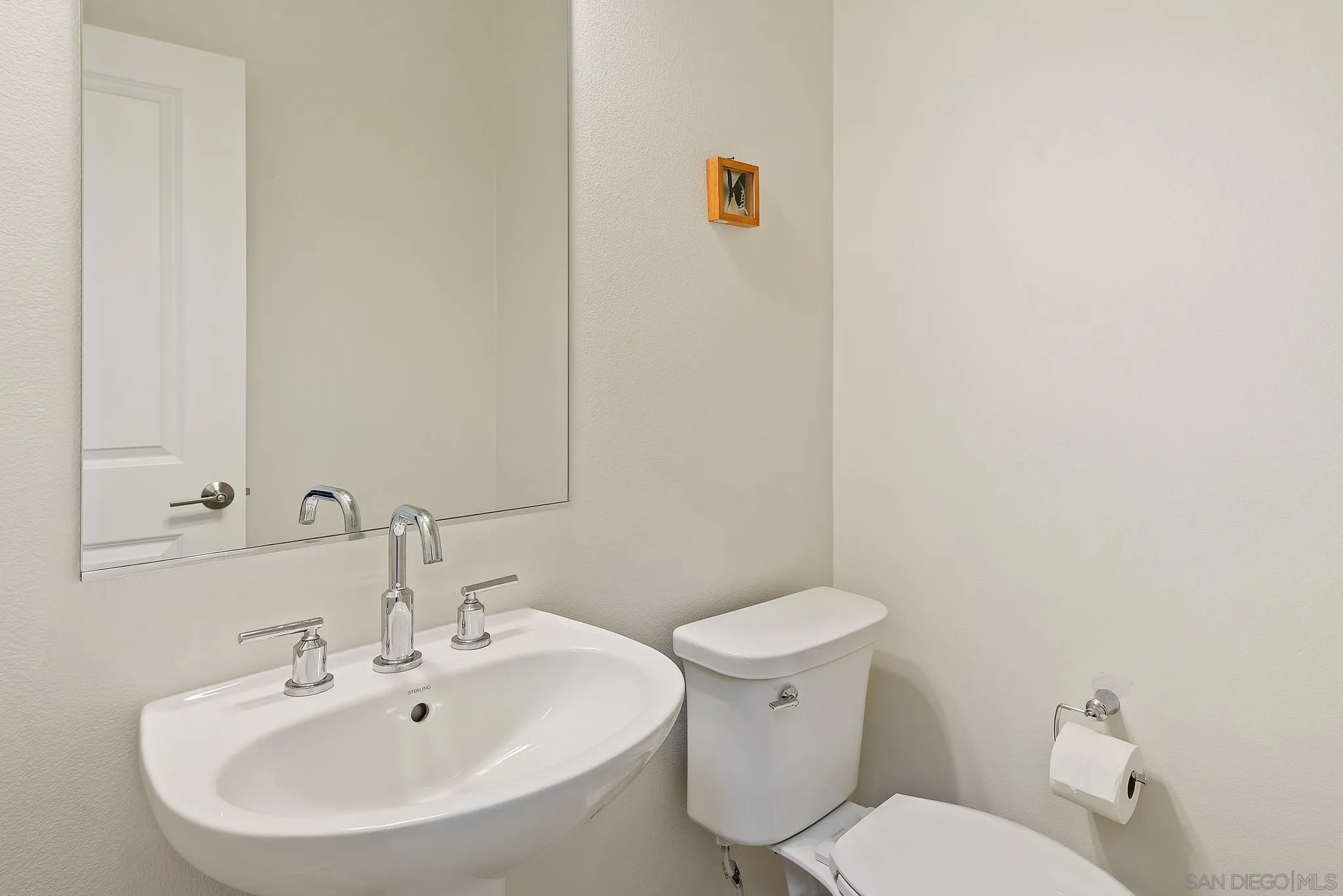 31657 Calle De Las Estrellas Bonsall, CA 92003 - Photo 17 of 30 a white toilet sitting next to a bathroom sink