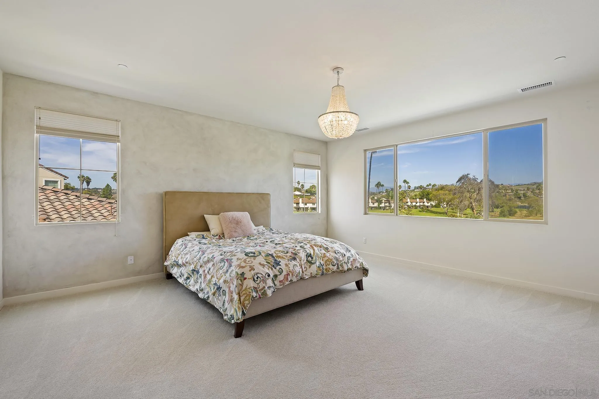 31657 Calle De Las Estrellas Bonsall, CA 92003 - Photo 23 of 30 a bedroom with a bed lamp and window