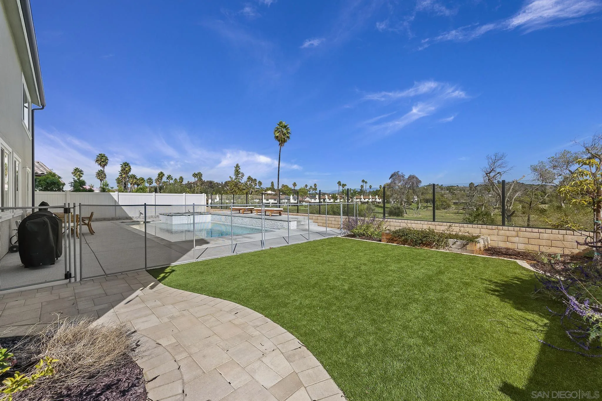 31657 Calle De Las Estrellas Bonsall, CA 92003 - Photo 26 of 30 a view of a garden with a lake
