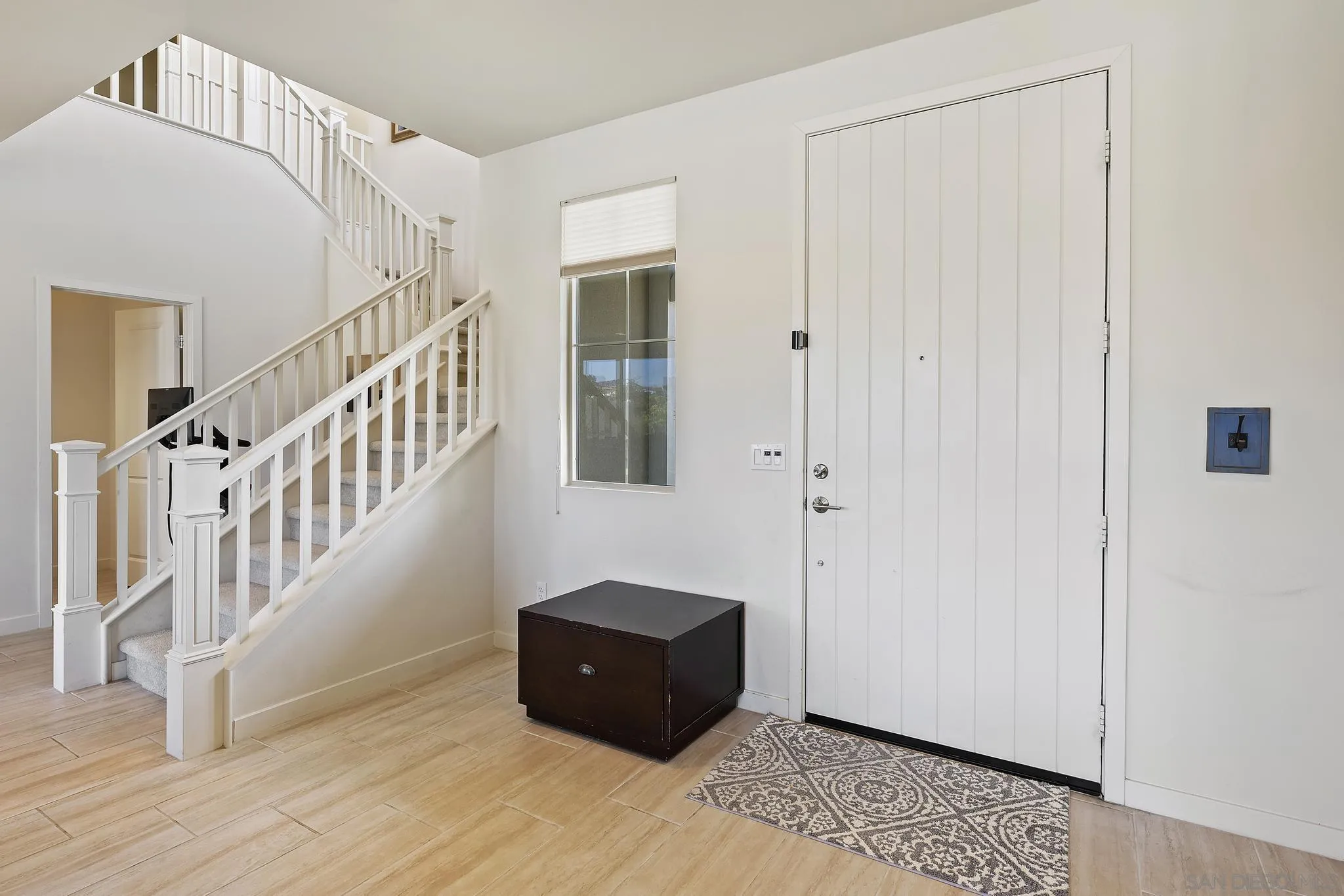 31657 Calle De Las Estrellas Bonsall, CA 92003 - Photo 6 of 30 a view of an entryway with wooden floor