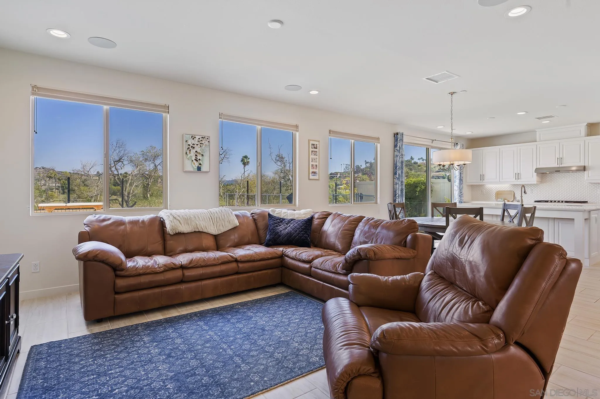 31657 Calle De Las Estrellas Bonsall, CA 92003 - Photo 7 of 30 a living room with furniture wooden floor and a window