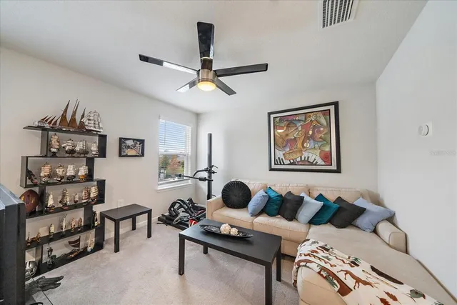 a bedroom with a bed and a desk