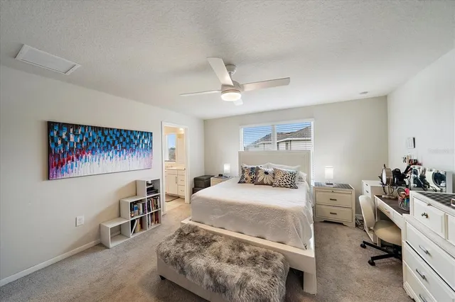 a bedroom with a bed dresser and a window