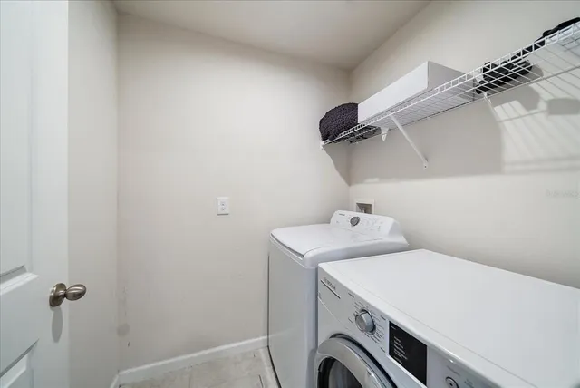 a bathroom with a double vanity sink mirror and shower