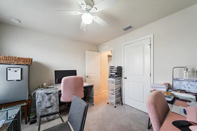a living room with a floor to ceiling window and floor to ceiling window