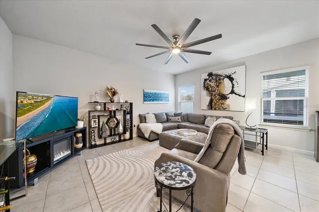 a kitchen with granite countertop a table chairs stainless steel appliances and cabinets