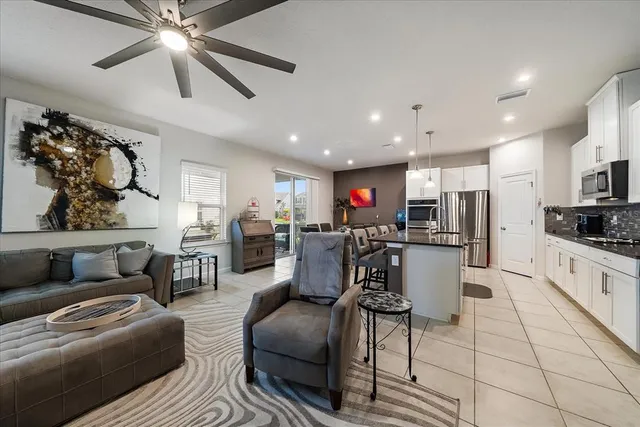 a large kitchen with lots of counter space and stainless steel appliances