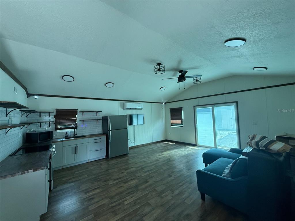 18312 Hollister Road Orlando, FL 32820 - Photo 5 of 10 a living room with furniture and a window