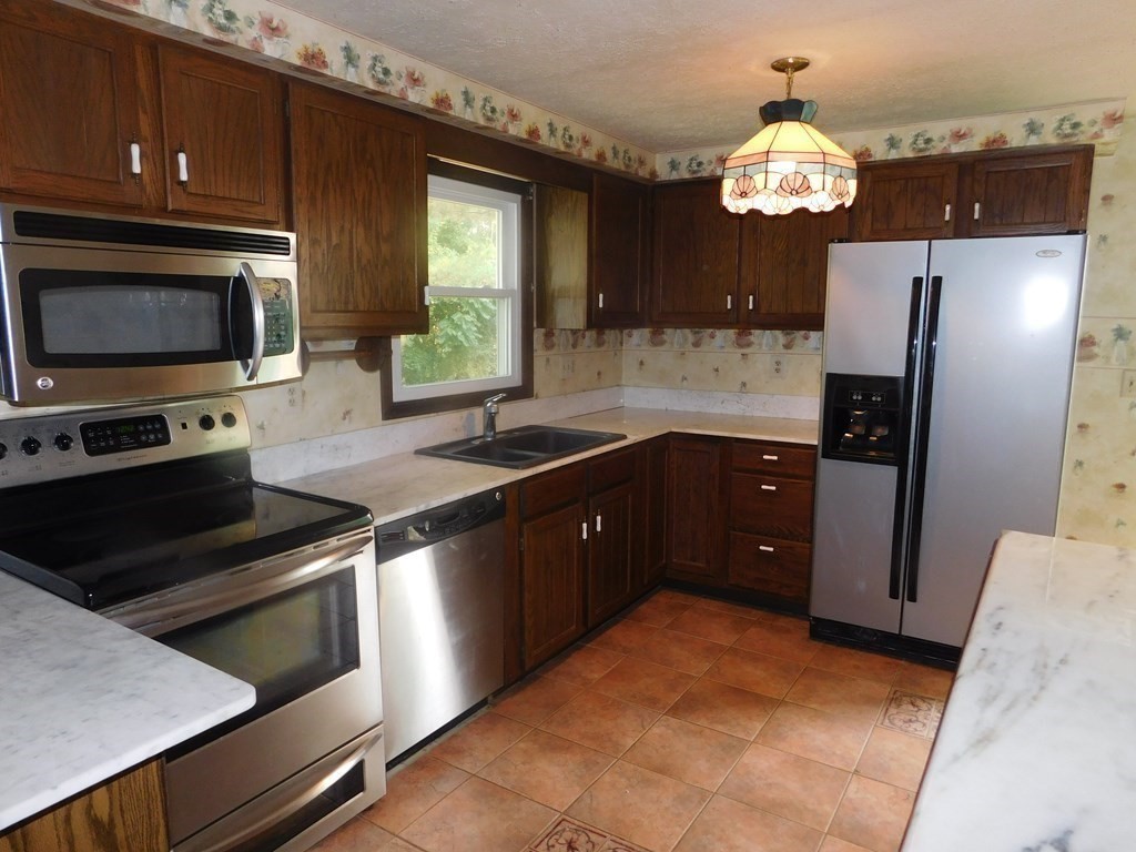 50 Bellvista Road Worcester, MA 01602 - Photo 4 of 20 a kitchen with stainless steel appliances granite countertop a refrigerator and a sink