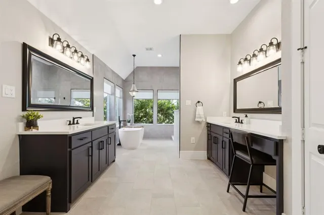 a room with a cabinets and a view of kitchen