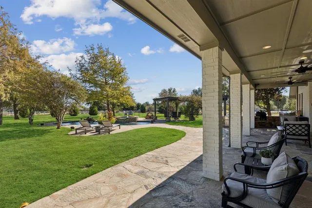a view of a backyard with sitting area