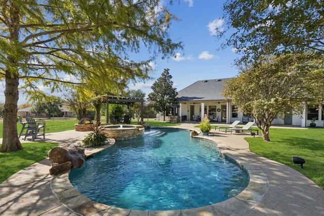 a view of a swimming pool with a sitting space