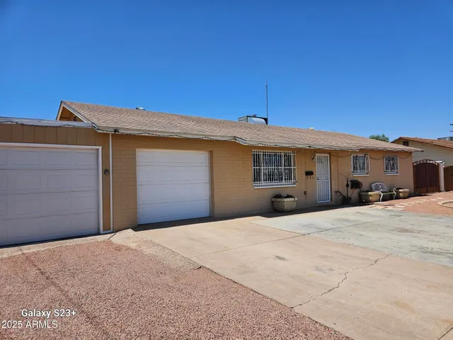 a front view of a house with a garage