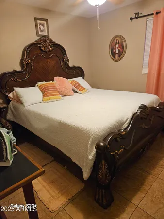 a bedroom with a bed and a table