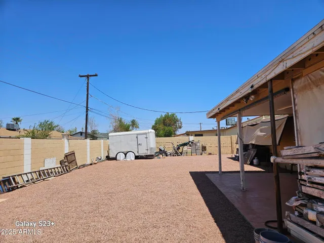 a balcony with table and chairs