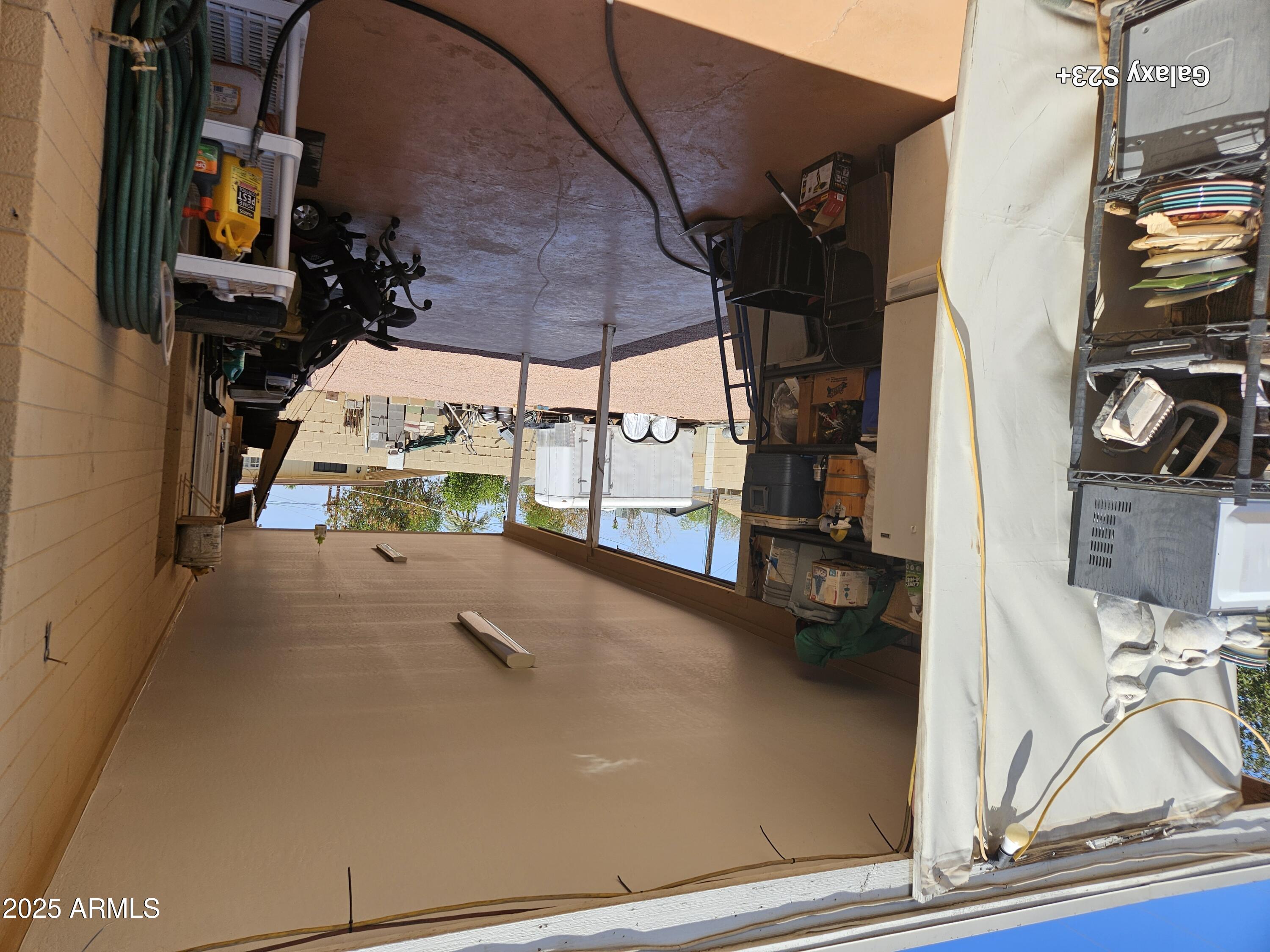 3020 North 40th Avenue Phoenix, AZ 85019 - Photo 8 of 36 a view of living room with furniture and a flat screen tv