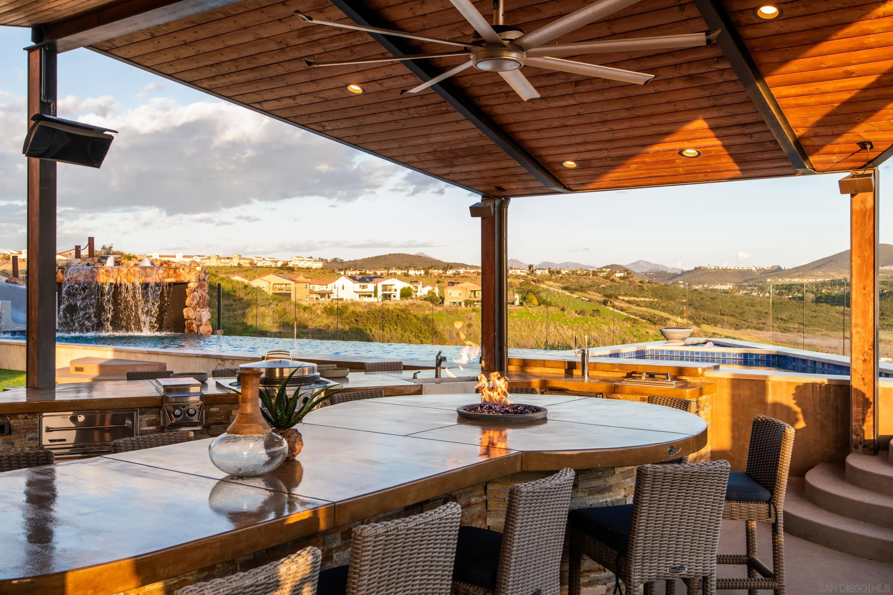 16339 Nicole Ridge Road San Diego, CA 92127 - Photo 16 of 56 a view of a swimming pool with a table and chairs