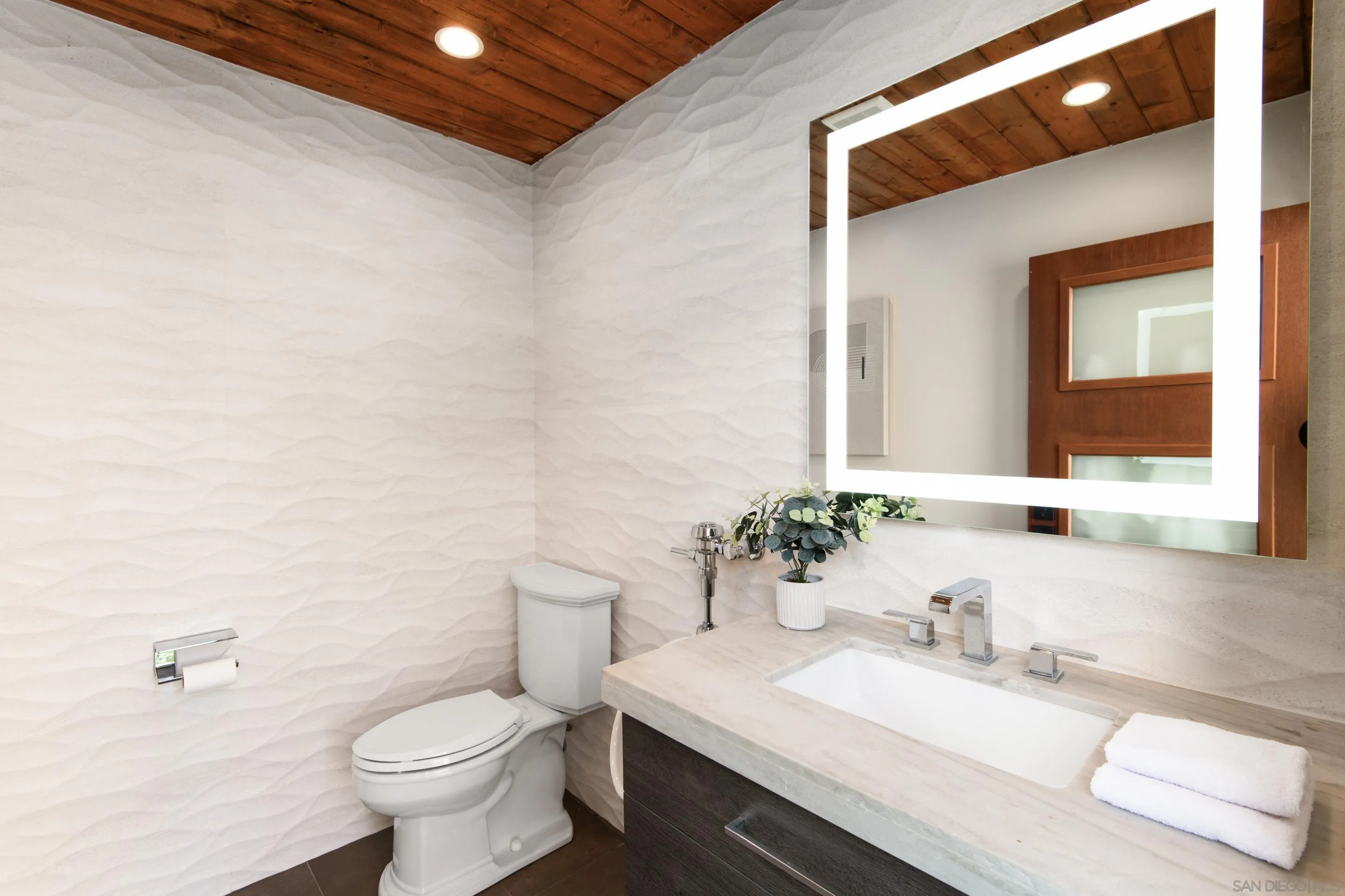 16339 Nicole Ridge Road San Diego, CA 92127 - Photo 18 of 56 a bathroom with a granite countertop sink toilet and mirror