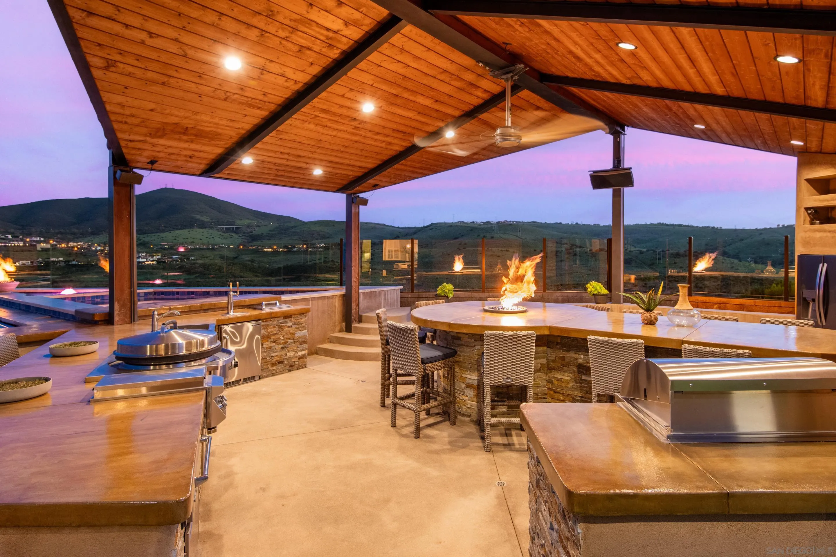 16339 Nicole Ridge Road San Diego, CA 92127 - Photo 19 of 56 a view of a patio with swimming pool table and chairs
