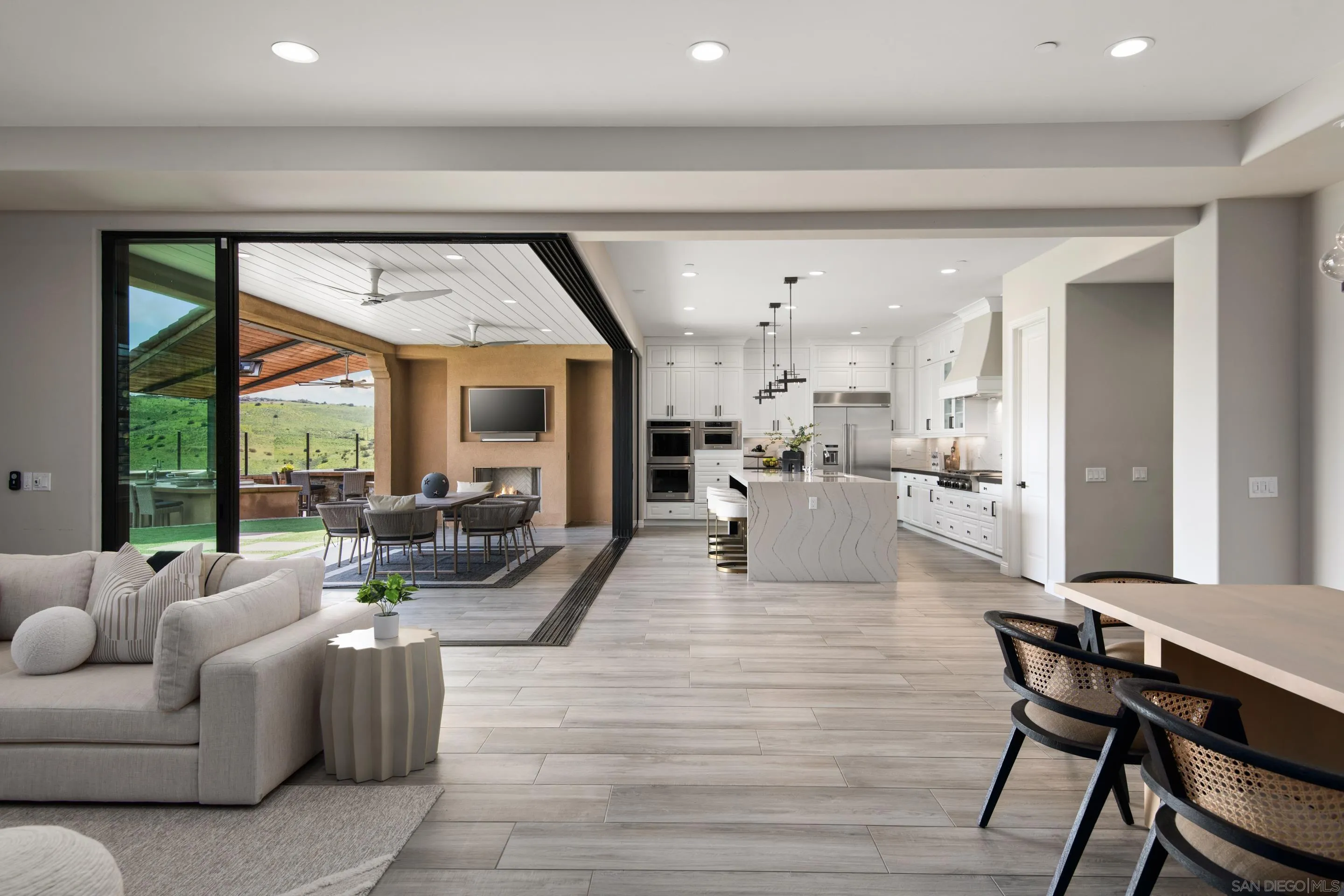 16339 Nicole Ridge Road San Diego, CA 92127 - Photo 22 of 56 a living room with furniture and a large window