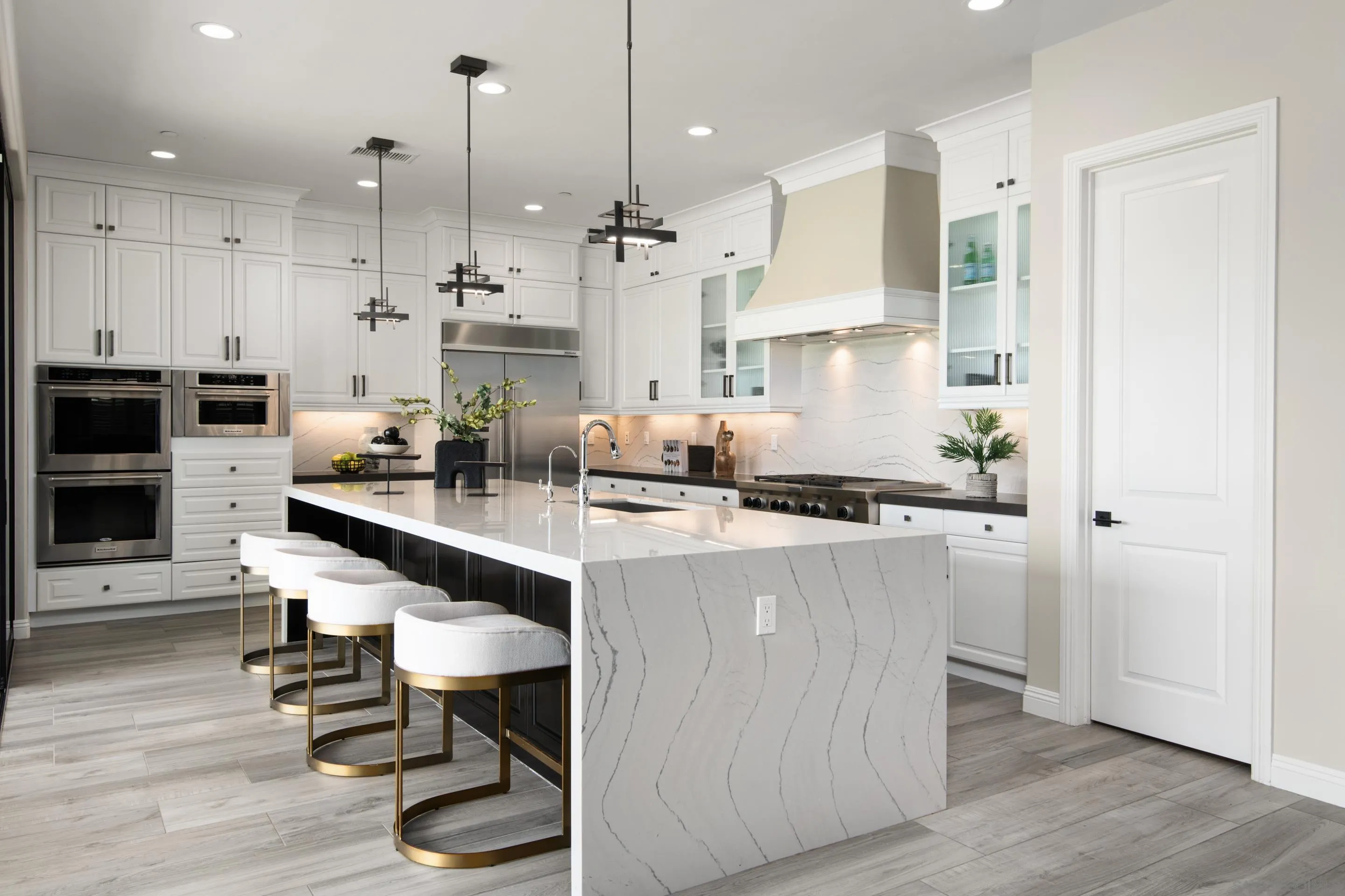 16339 Nicole Ridge Road San Diego, CA 92127 - Photo 24 of 56 a kitchen with stainless steel appliances granite countertop a refrigerator a oven and a stove with wooden floors