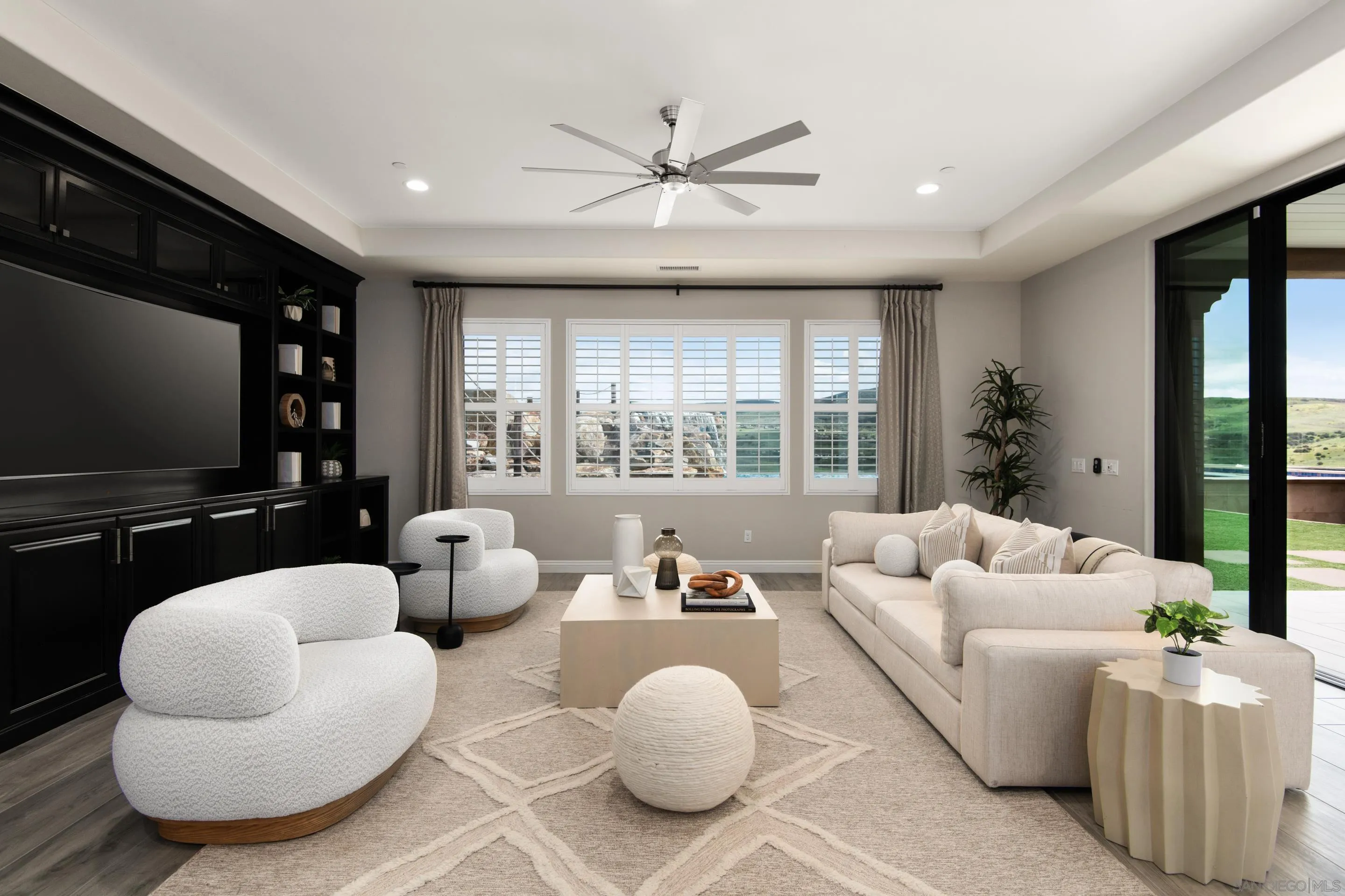 16339 Nicole Ridge Road San Diego, CA 92127 - Photo 28 of 56 a living room with furniture and a flat screen tv