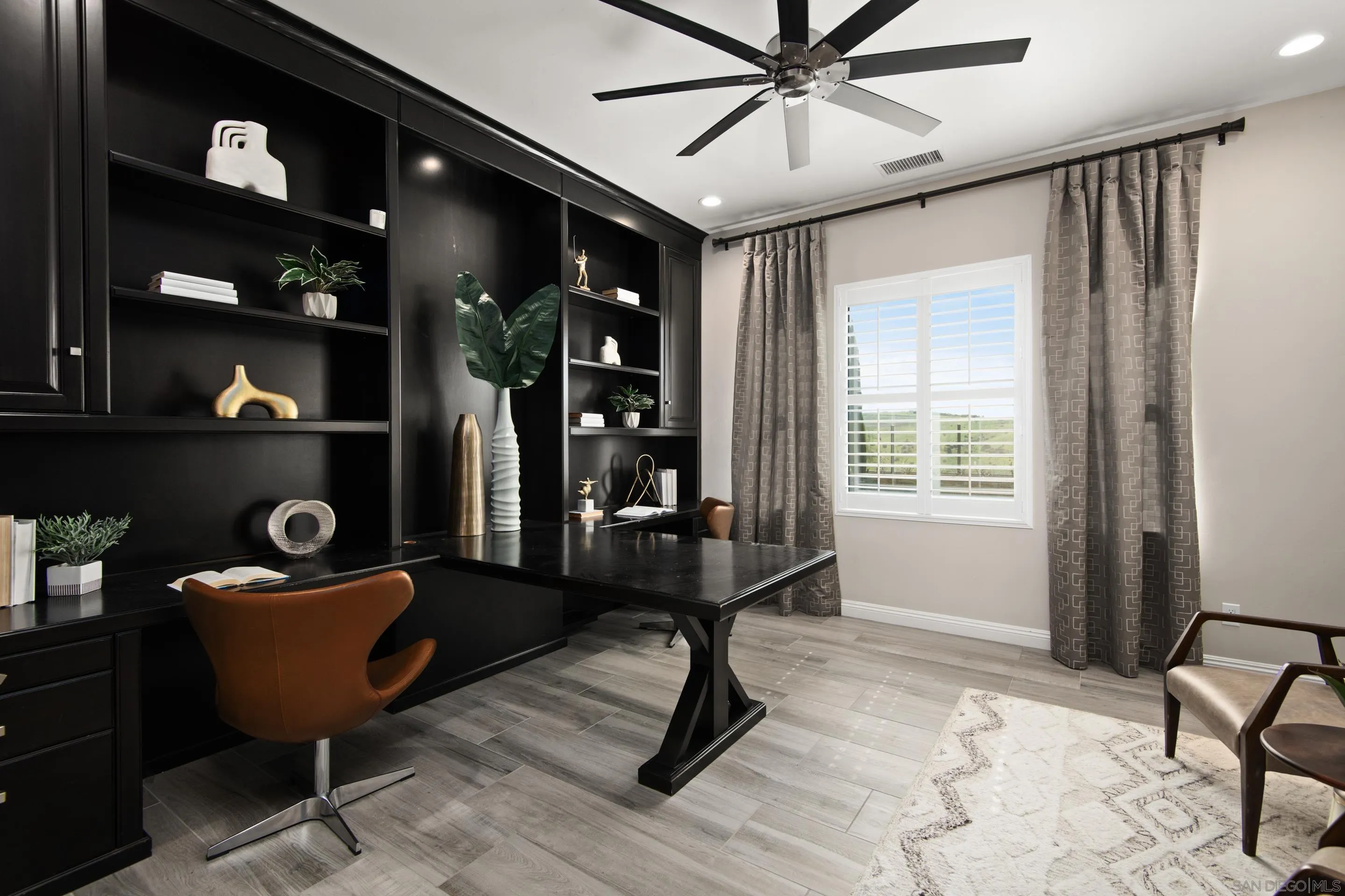 16339 Nicole Ridge Road San Diego, CA 92127 - Photo 32 of 56 a view of a workspace with furniture and a window