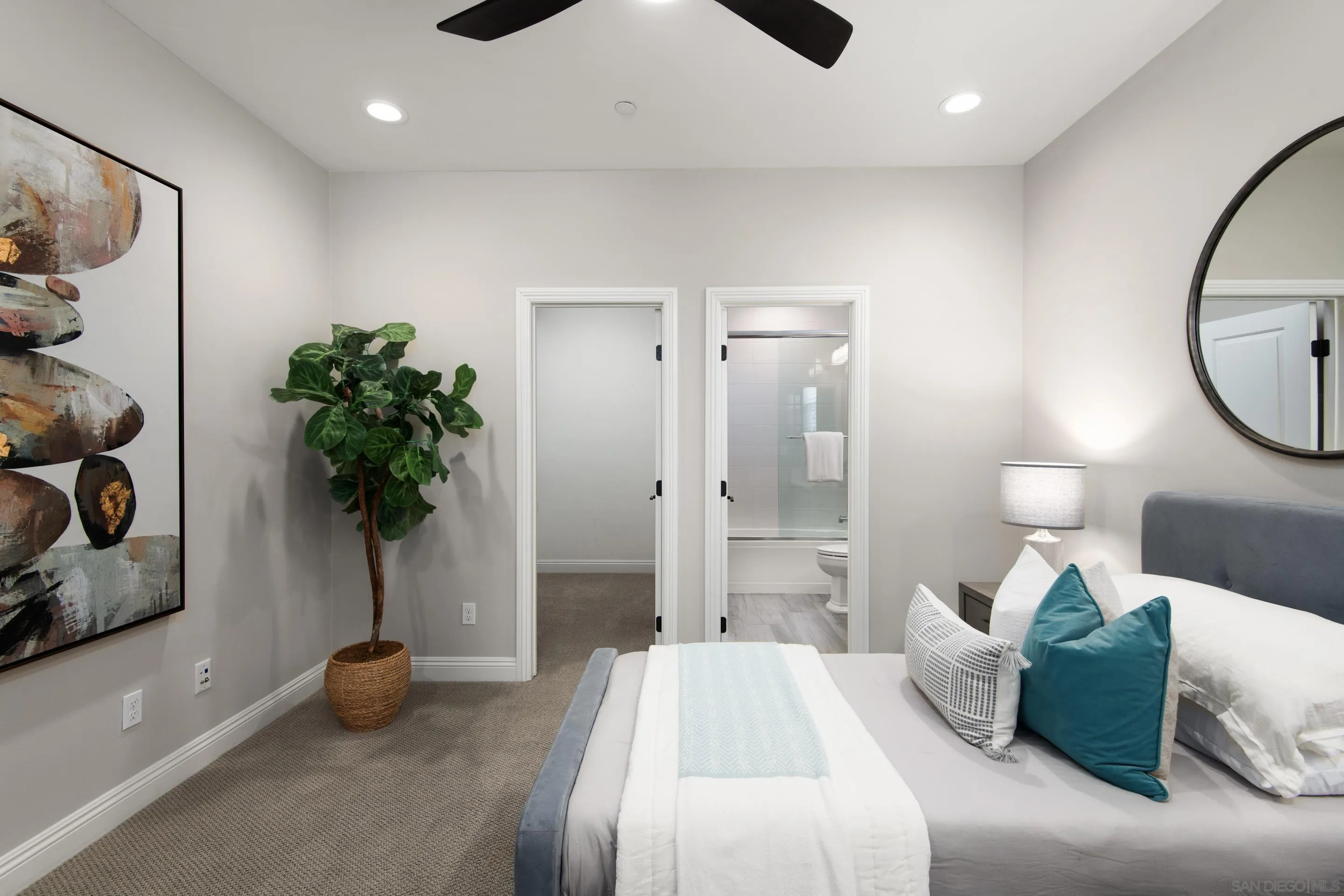 16339 Nicole Ridge Road San Diego, CA 92127 - Photo 38 of 56 a bedroom with a bed and a potted plant