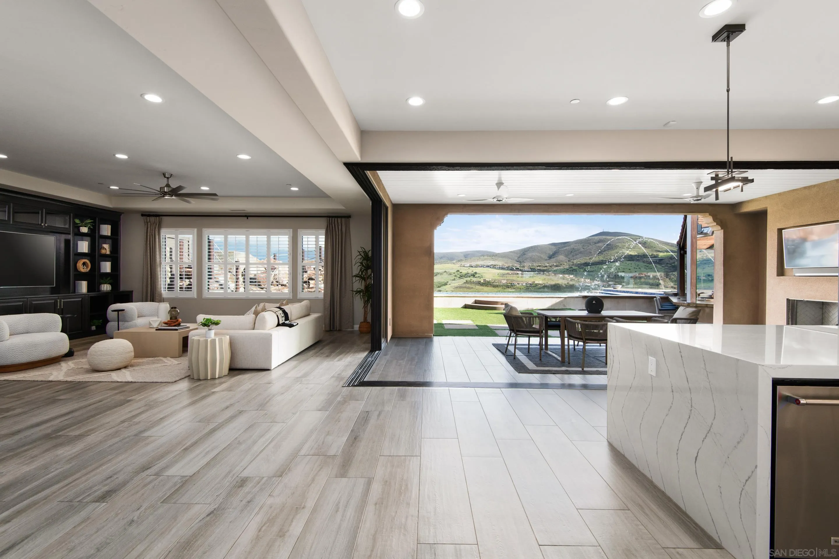 16339 Nicole Ridge Road San Diego, CA 92127 - Photo 4 of 56 a living room with furniture large window and flat screen tv