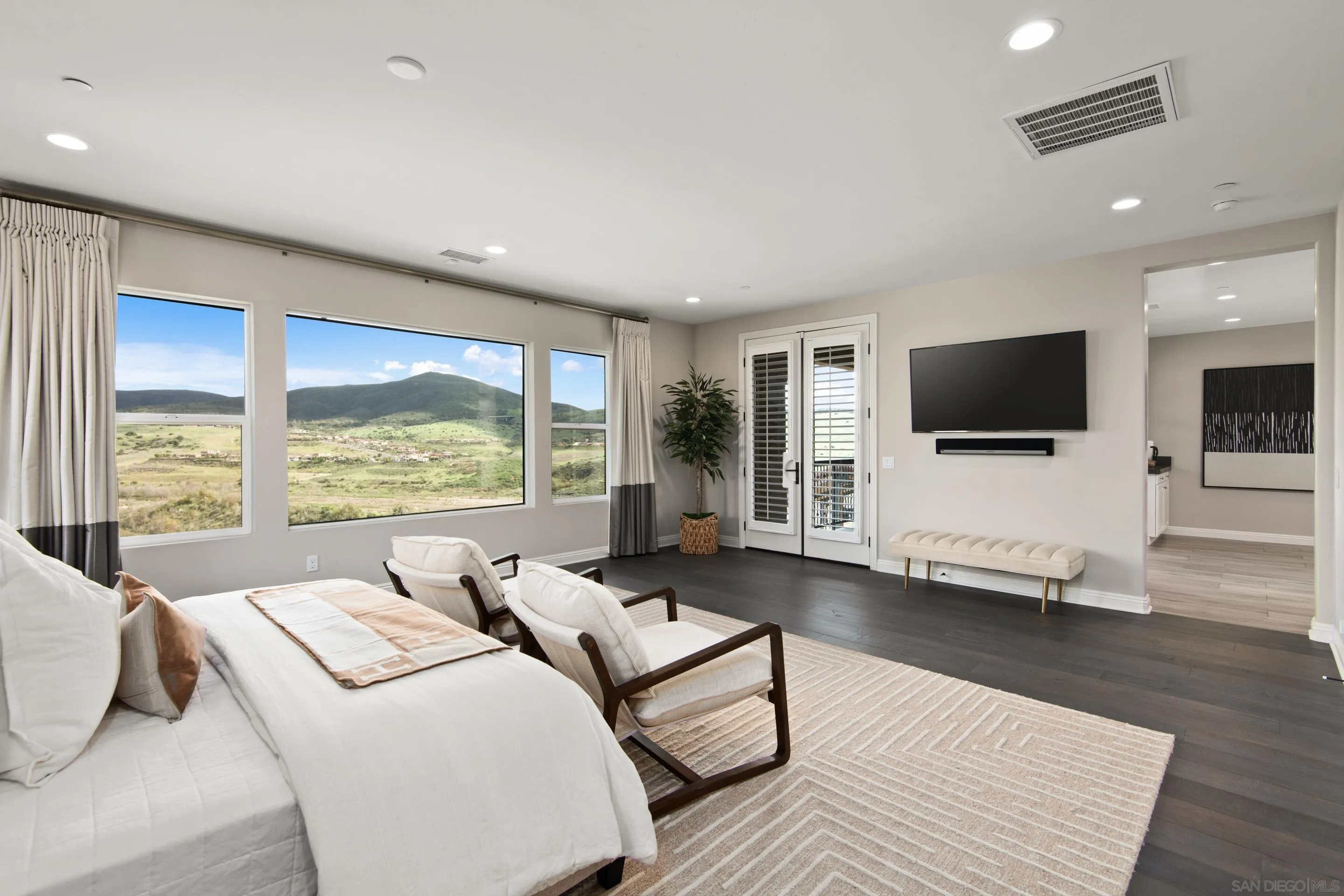 16339 Nicole Ridge Road San Diego, CA 92127 - Photo 41 of 56 a living room with furniture and a flat screen tv