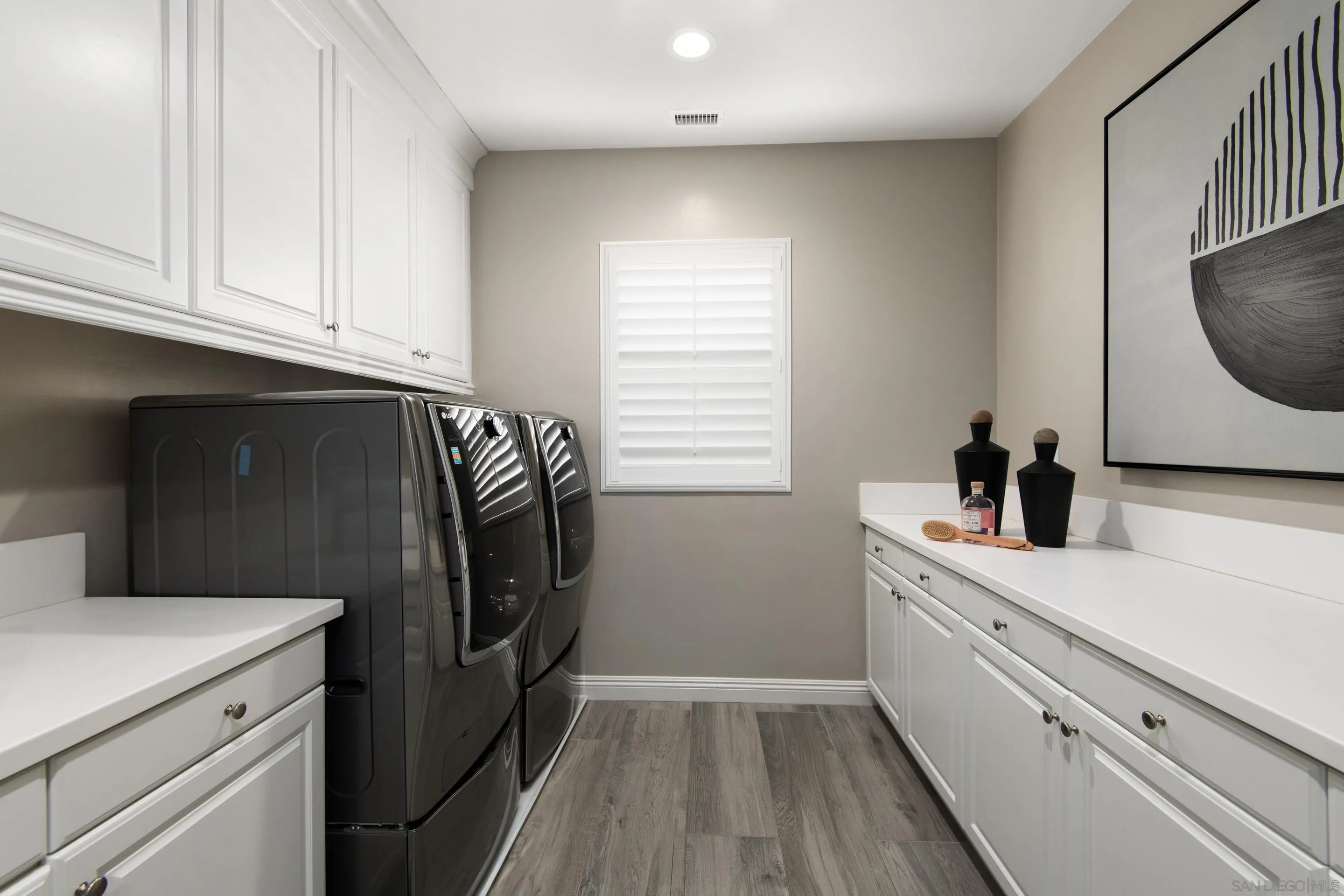 16339 Nicole Ridge Road San Diego, CA 92127 - Photo 52 of 56 a utility room with cabinets washer and dryer