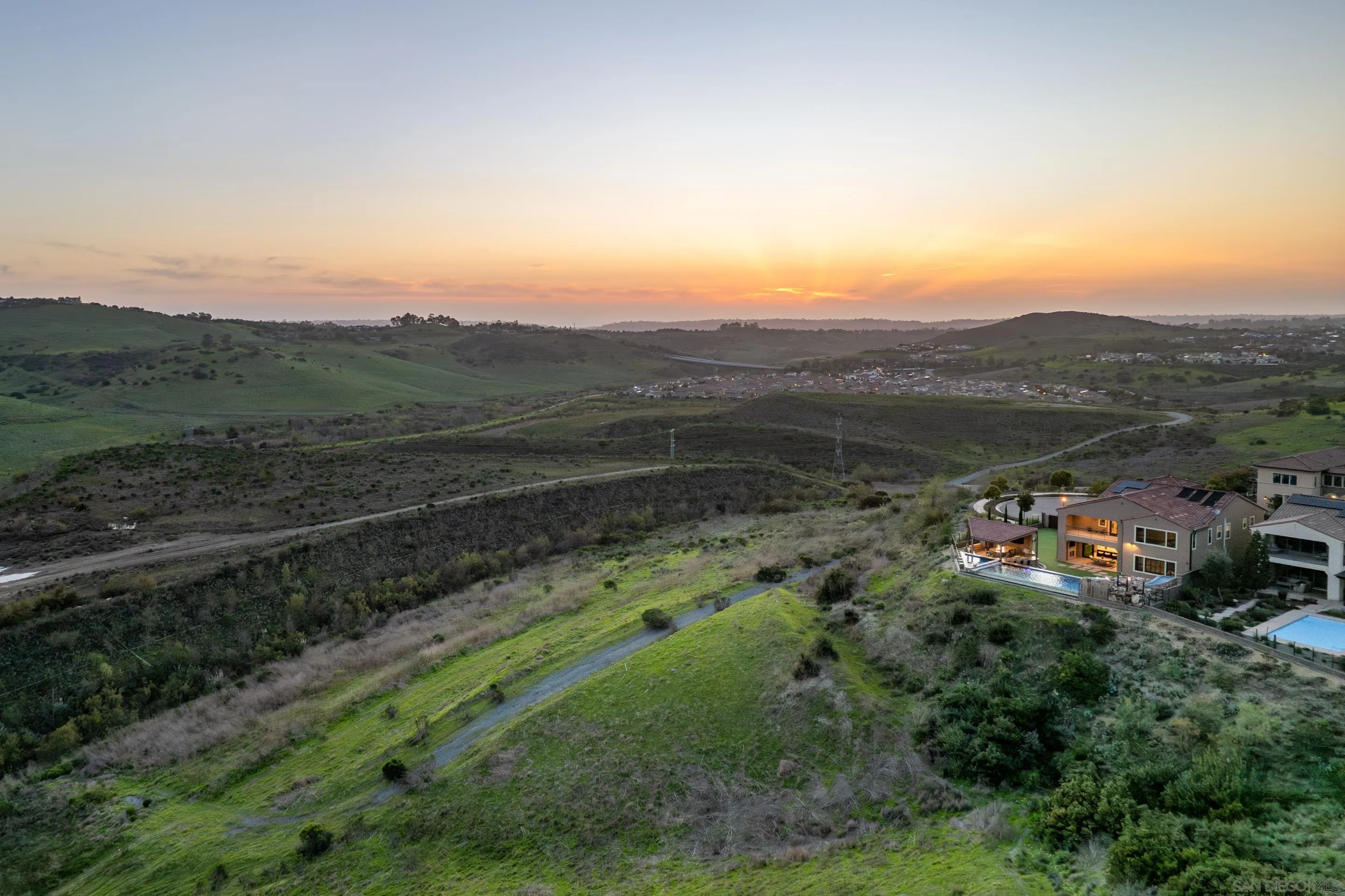 16339 Nicole Ridge Road San Diego, CA 92127 - Photo 56 of 56 a view of a green field with mountains in the background