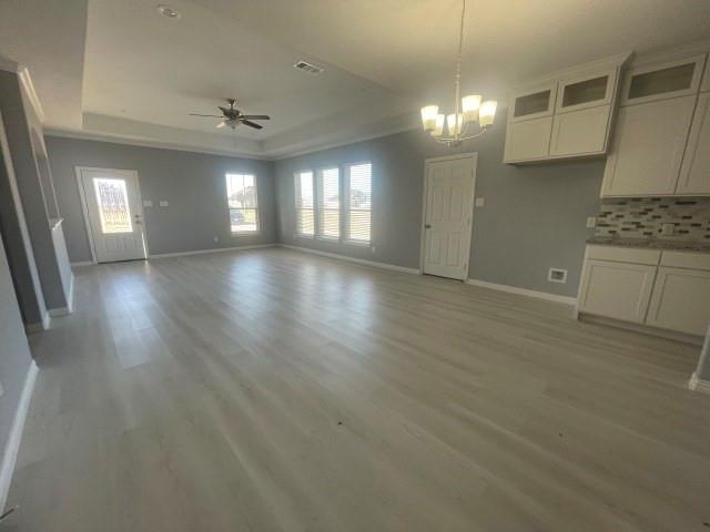 938 Genesis Road Rice, TX 75155 - Photo 4 of 13 an empty room with wooden floor and windows