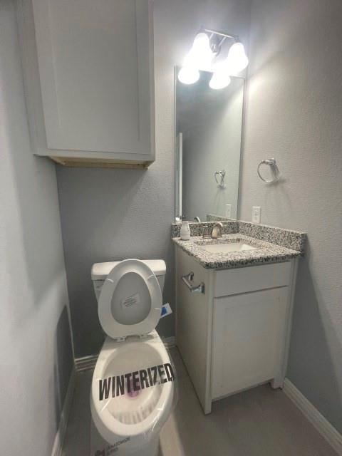 938 Genesis Road Rice, TX 75155 - Photo 7 of 13 a bathroom with a sink a vanity and a mirror